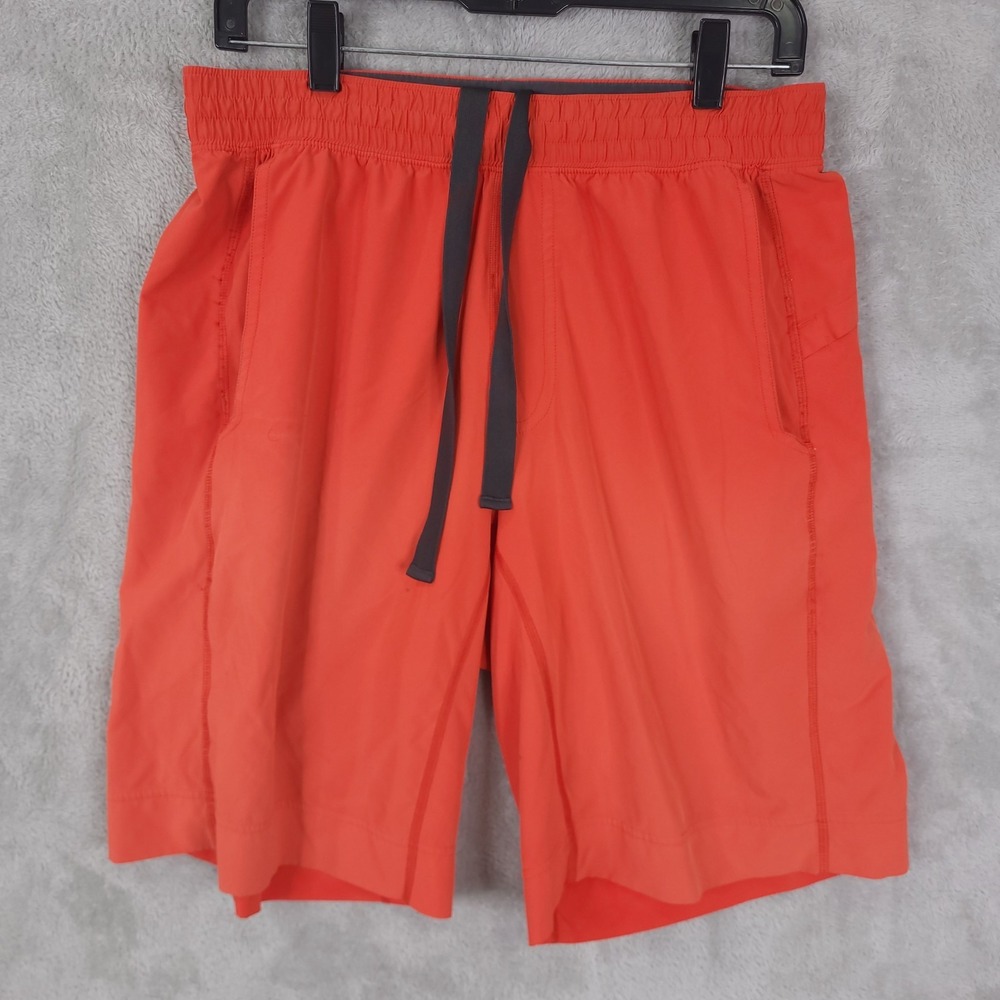 lululemon license to train linerless short men M orange active stretch 30" Waist